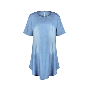 Detailed view of light blue denim dress showing soft fabric texture and curved hemline