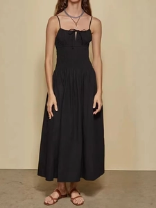Elegant black backless A-line midi dress with spaghetti straps and front bow detail