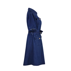 Detailed side view of dark blue denim dress featuring lapel collar and waist tie belt