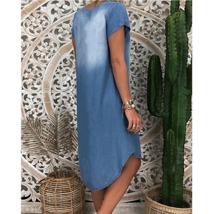 Detailed back view of a loose denim dress with a stylish high-low curved hemline