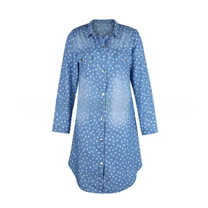 Close-up of light blue star print shirt dress with button-up front and chest pockets