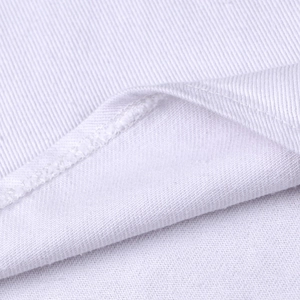 Close-up of premium white denim fabric showing high-density texture and stitching