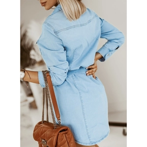 Women's light blue denim shirt dress with long sleeves and mini length, side back view