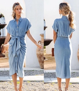 Front and back detail of light blue denim shirt dress with short sleeves and waist tie