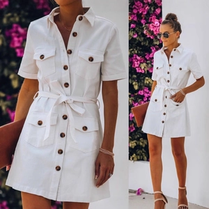 White short sleeve denim shirt dress with waist tie and pockets in a summer casual style