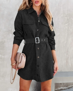 Detail of black corduroy shirt dress with chest pockets and adjustable waist belt