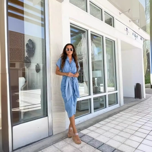 Light blue short sleeve denim midi dress with lapel collar and waist tie detail