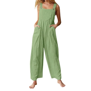 Detail of light green wide-leg jumpsuit showing cotton linen fabric and button straps