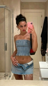 Detail of light blue denim tube top and frayed skirt set with vintage contrast stitching