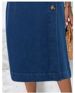 Detail view of a dark blue A-line denim skirt featuring a retro button and hem stitching