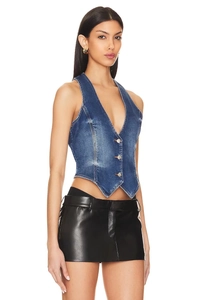 Detail of dark blue denim halter vest with metal buttons and pointed cropped hemline