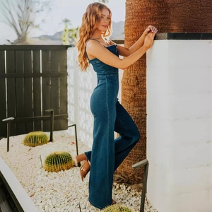 Slim fit dark blue denim jumpsuit with spaghetti straps and wide leg pants design