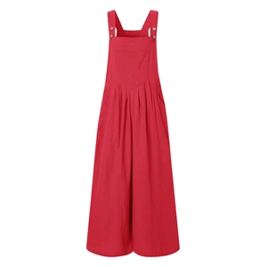 Detail of red wide-leg jumpsuit with decorative shoulder buttons and large chest pocket