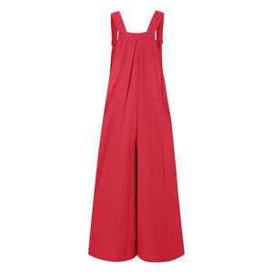 Detail of red wide-leg jumpsuit showing natural cotton linen texture and shoulder straps