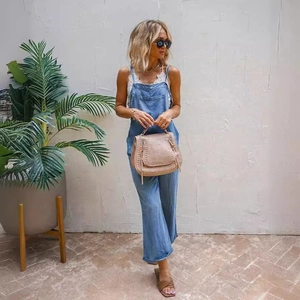 Women's light blue denim overalls with straight leg cut and front pocket in casual style