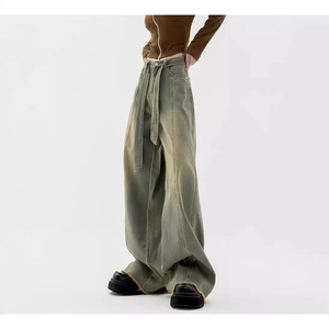 Retro washed wide leg jeans with adjustable belt and distressed fringe hem detail
