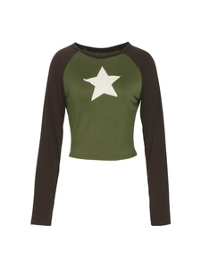 Detail of the white star applique on this vintage cropped raglan top with green and brown sleeves