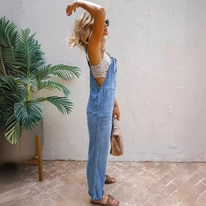 Women's light blue denim overalls with cargo pockets and side-view casual styling