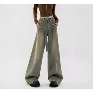 Retro washed high waist wide leg jeans with matching belt and distressed hem detail