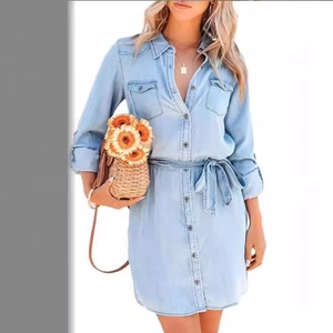 Light blue denim shirt dress with long sleeves, waist tie belt and button-up front