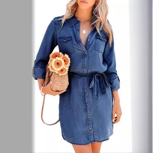 Women's long sleeve dark blue denim shirt dress with waist tie and button front pockets