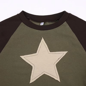 Short sleeve crop top with star patch, round neck, and contrast raglan sleeves