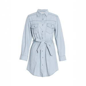 Detail view of light blue denim shirt dress with chest pockets and waist belt ties