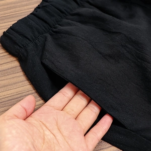 Women's black casual cotton linen trousers with elastic waist and slanted pockets