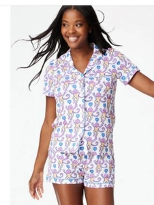 Detailed view of the two-piece pajama set with playful monkey and blue heart patterns