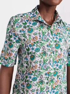 Women's short sleeve shirt featuring colorful floral prints and a classic button-down collar