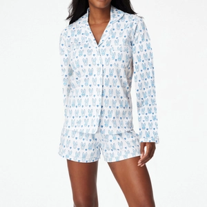 Women's pajama set featuring short sleeve button shirt and shorts with rabbit print