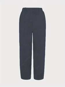 Detail view of high elastic waistband and smooth fabric on casual cropped pants