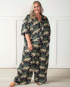 Detail of tiger print pajama set featuring V-neck short sleeve top and wide leg pants