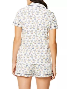 Detail view of women's short sleeve pajama set featuring colorful cartoon rabbit prints