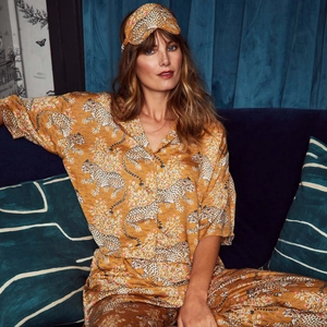 Detailed view of ginger yellow tiger print silk pajama set with long pants and matching eye mask