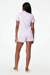 Rear view of lavender two-piece pajama set with cartoon print and short-sleeved top