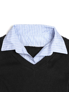 Detail of V-neck knitted sweater with blue and white striped shirt collar neckline