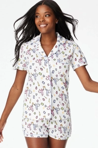 Detail view of women short sleeve pajama set with monkey and champagne bottle prints