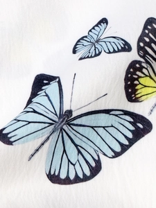 Elegant white butterfly print shirt for women featuring a lightweight textured fabric design