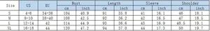 Tableau des tailles détaillé pour robe à carreaux, mesures S-XL en cm et pouces