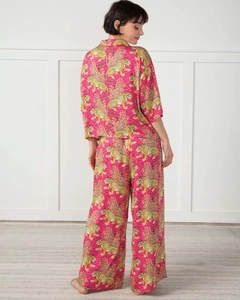 Rear view of vibrant fuchsia loungewear set featuring leopard print and fluid drape fabric