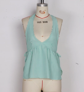 Detail of green and white vertical striped halter top with V-neckline and side tie detail
