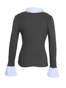 Detail of dark grey knit top with blue and white striped shirt collar and cuff patchwork