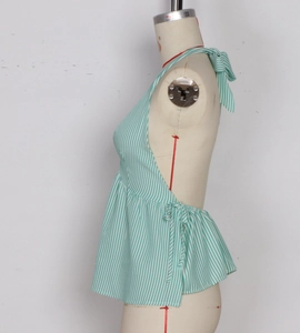 Detail of mint green striped halter top showing side drawstring and ruffled hem