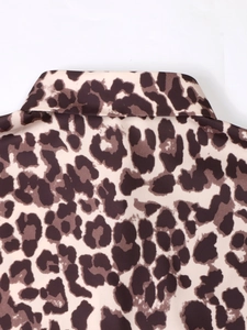 Detail of classic leopard print shirt collar with beige and dark coffee spots pattern