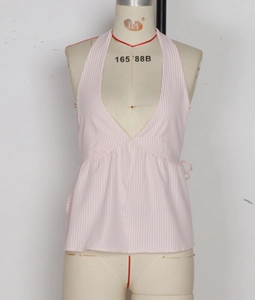 Detail of pink and white striped halter top with deep V-neck and peplum hem design
