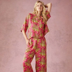 Pink leopard print two-piece pajama set with short sleeve button-down shirt and trousers