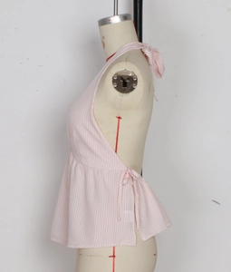 Detail of pink and white striped halter top with open back and side tie-up closure