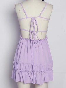 Detail view of lavender backless dress with multi-tie straps and layered ruffle hem