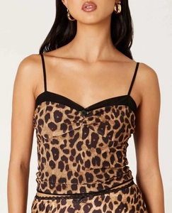 Detailed view of leopard print camisole with black mesh lace and small floral detail
